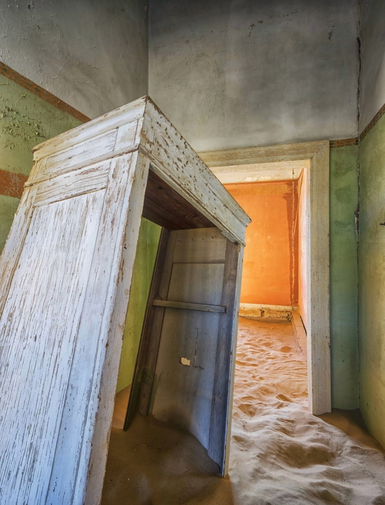 Sand in the rooms of a colourful and abandoned house Kolmanskop Namibia Canvas Art - Robert Postma Design Pics (13 x 17)