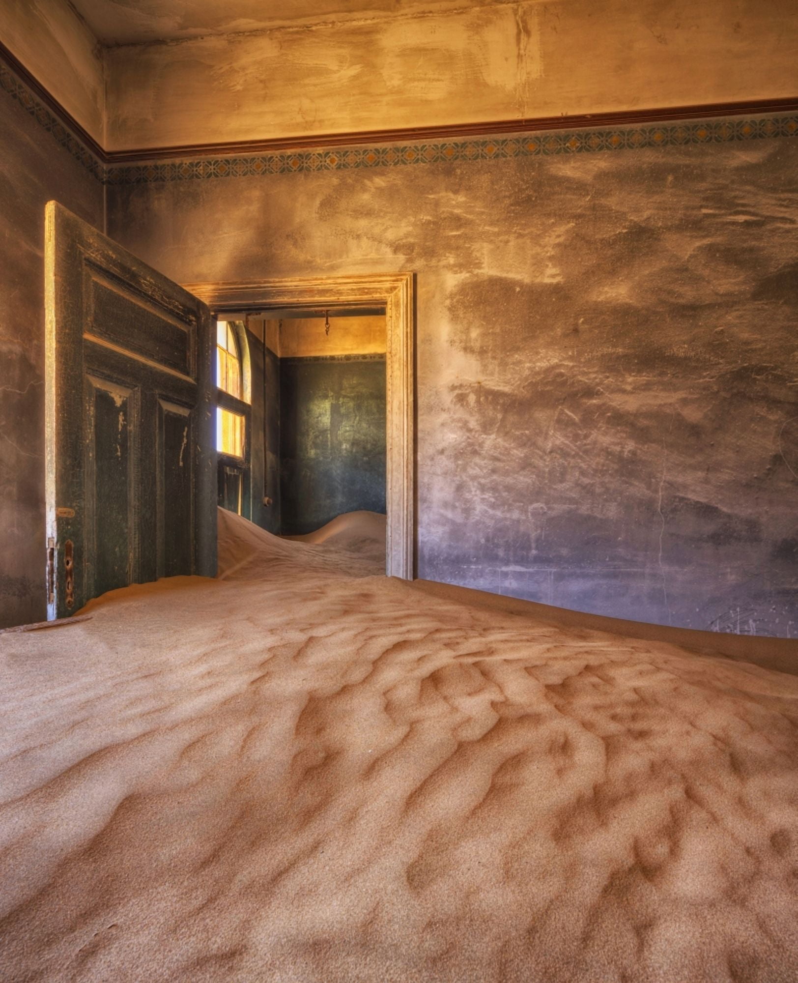 Sand in the rooms of a colourful and abandoned house Kolmanskop Namibia Canvas Art - Robert Postma Design Pics (28 x 34)