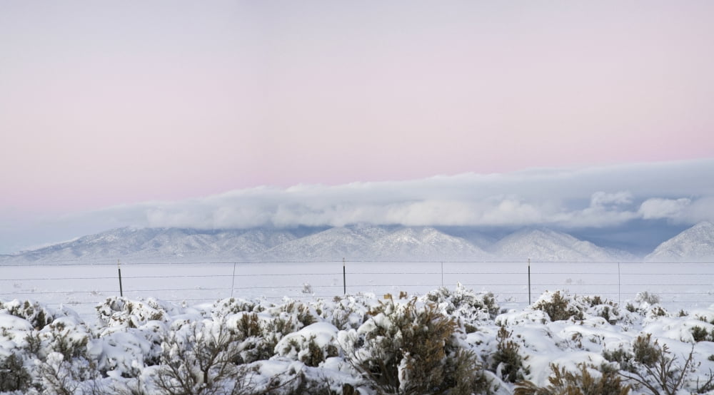 Sangre De Cristo Range with clouds and pink sky seen from NM highway 64 San Luis Valley Colorado USA Canvas Art - Panoramic Images (24 x 14)