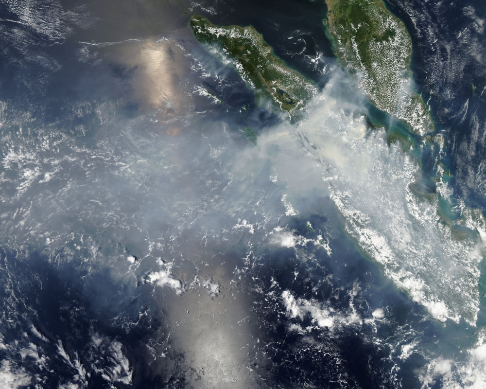 Satellite view of smoke and fires burning in Sumatra Canvas Art - Stocktrek Images (31 x 25)