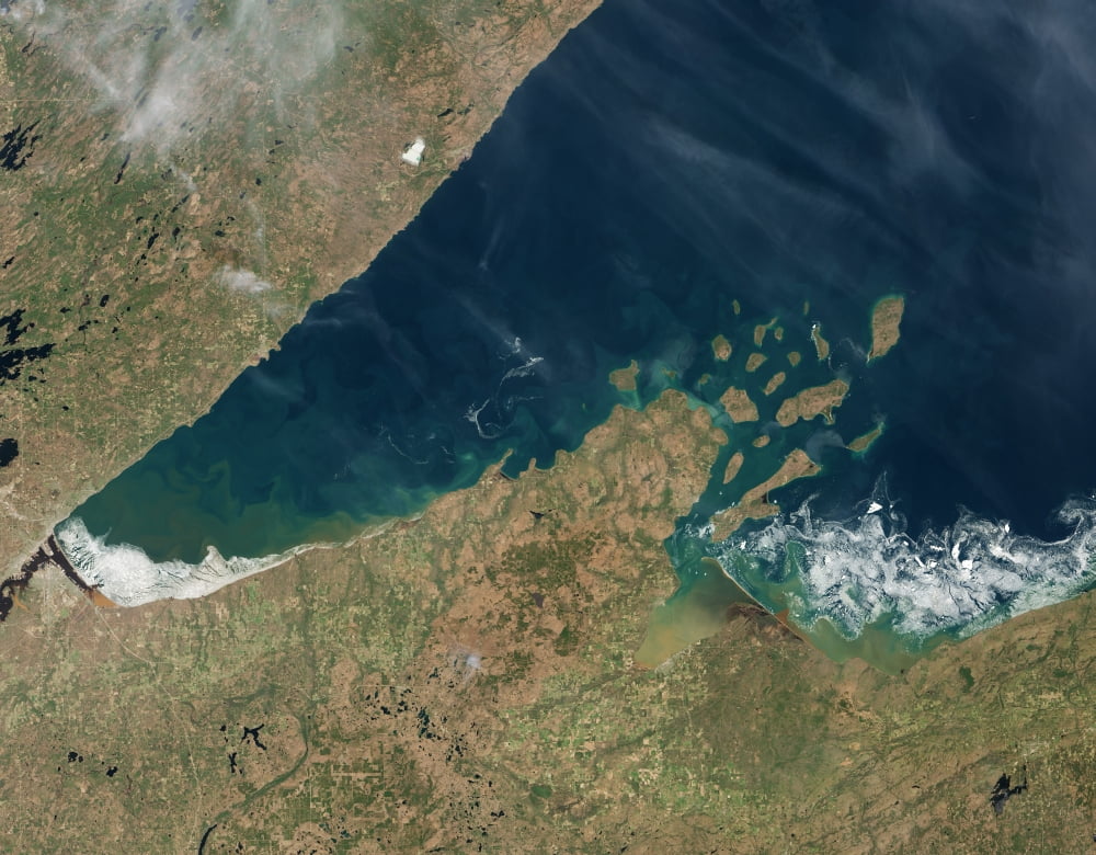 Satellite view showing chunks of ice afloat on Lake Superior Canvas Art - Stocktrek Images (32 x 25)