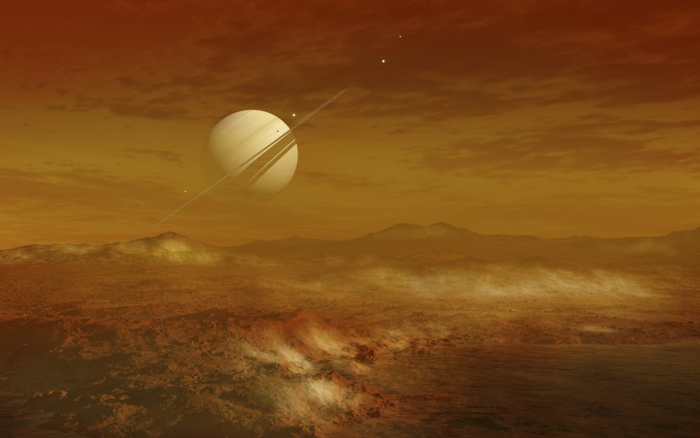 Saturn above the thick atmosphere of its moon Titan Canvas Art - Fahad SulehriaStocktrek Images (36 x 23)