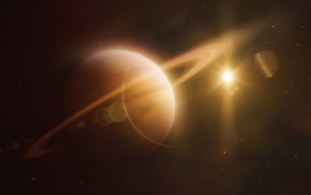 Saturn in outer space against Sun and star field Canvas Art - Evgeny KuklevStocktrek Images (36 x 23)