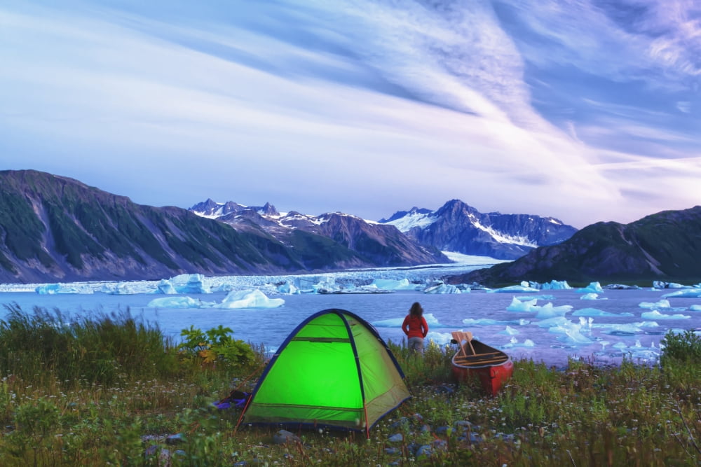 Scenic View A Woman Enjoying The Sunset Next To A Lit Tent Bear Glacier Lake Kenai Fjords National Park Kenai Peninsula Southcentral Alaska Summer Hdr Canvas Art - Michael DeYoung  Design Pics (34 x 2