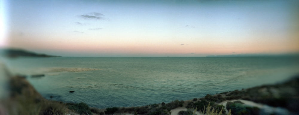 Scenic view of Rocky Coastline and the Pacific Ocean at sunset Long Beach Los Angeles County California USA Canvas Art - Panoramic Images (6 x 15)