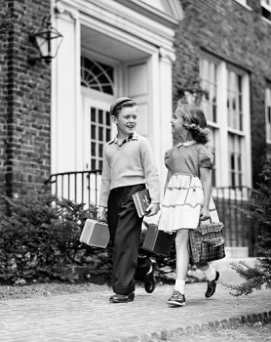 Schoolboy and schoolgirl walking on a walkway Canvas Art - (24 x 36)