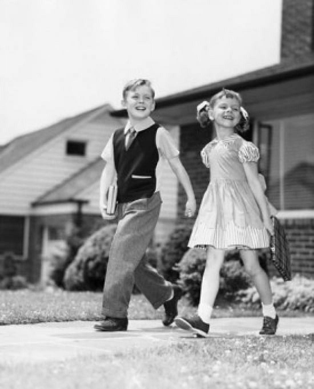 Schoolboy and schoolgirl walking on foorpath and smiling Canvas Art - (18 x 24)