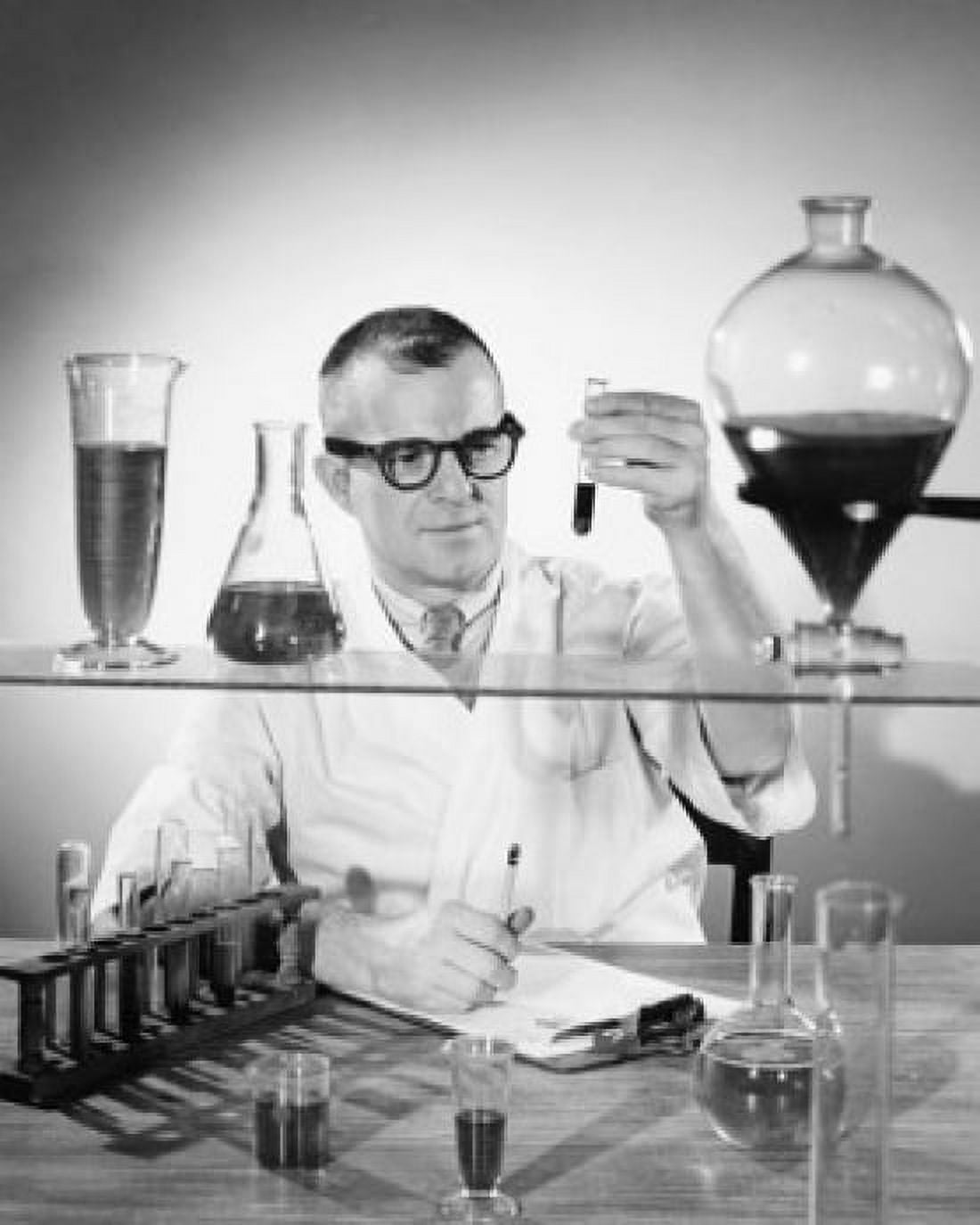 Scientist examining chemical in a test tube Canvas Art - (18 x 24)