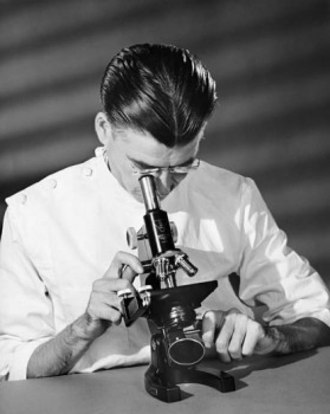 Scientist looking through a microscope in a laboratory Canvas Art - (18 x 24)