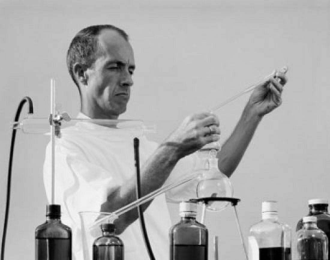 Scientist mixing chemicals in laboratory Canvas Art - (24 x 36)