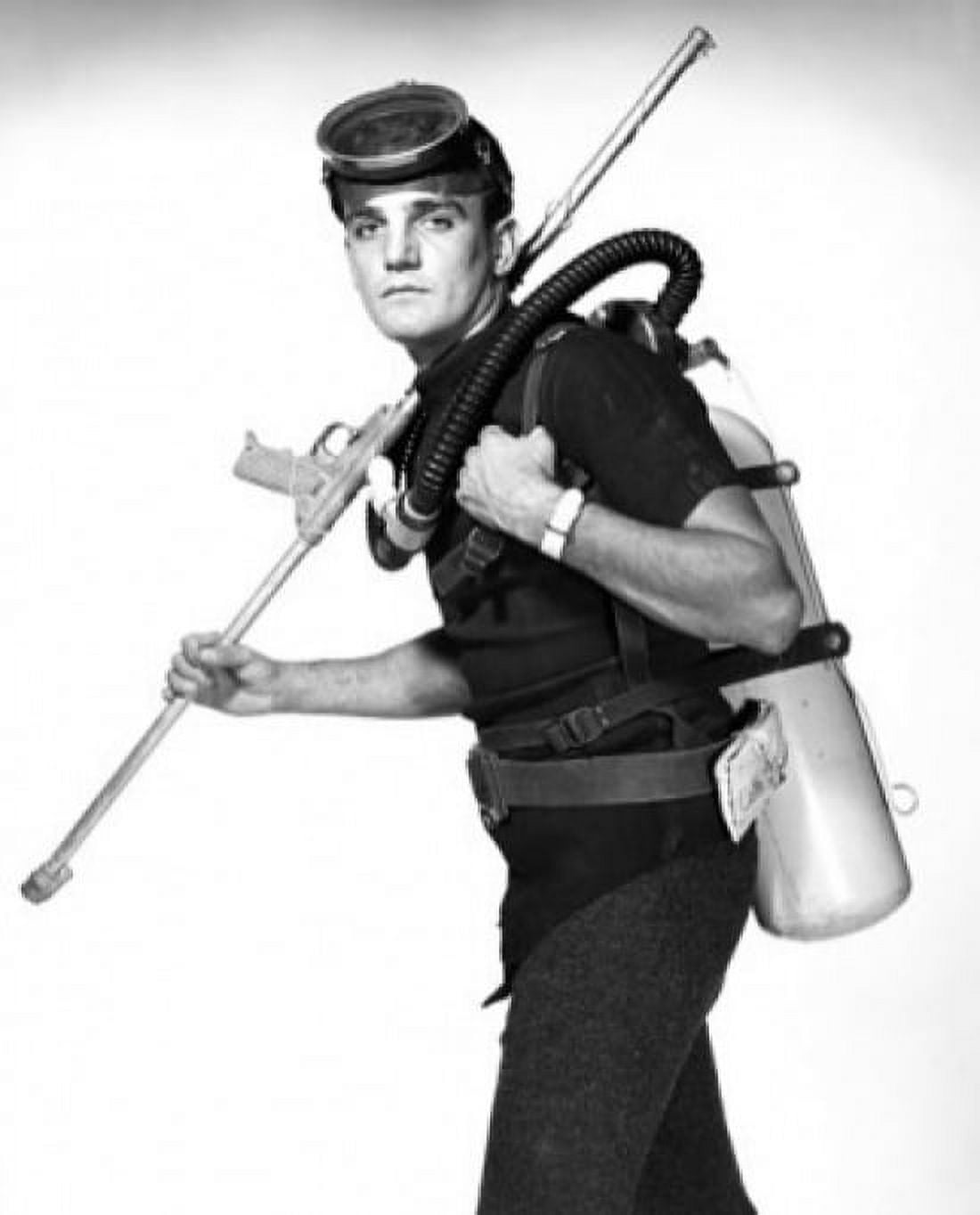 Scuba diver carrying oxygen tank and speargun Canvas Art - (24 x 36)