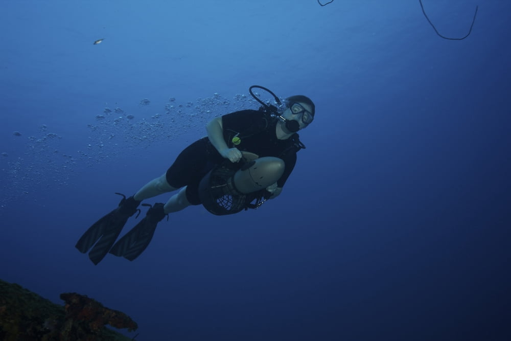 Scuba diver uses a diver propulsion vehicle off the coast of Bonaire Caribbean Netherlands Canvas Art - Terry MooreStocktrek Images (18 x 12)