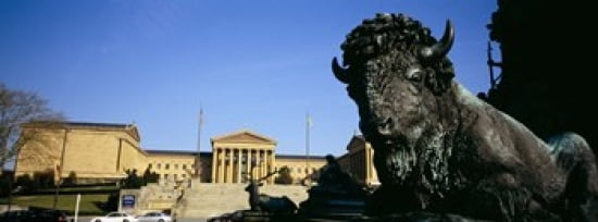 Sculpture of a buffalo with a museum in the background Philadelphia Museum Of Art Philadelphia Pennsylvania USA Canvas Art - Panoramic Images (30 x 12)