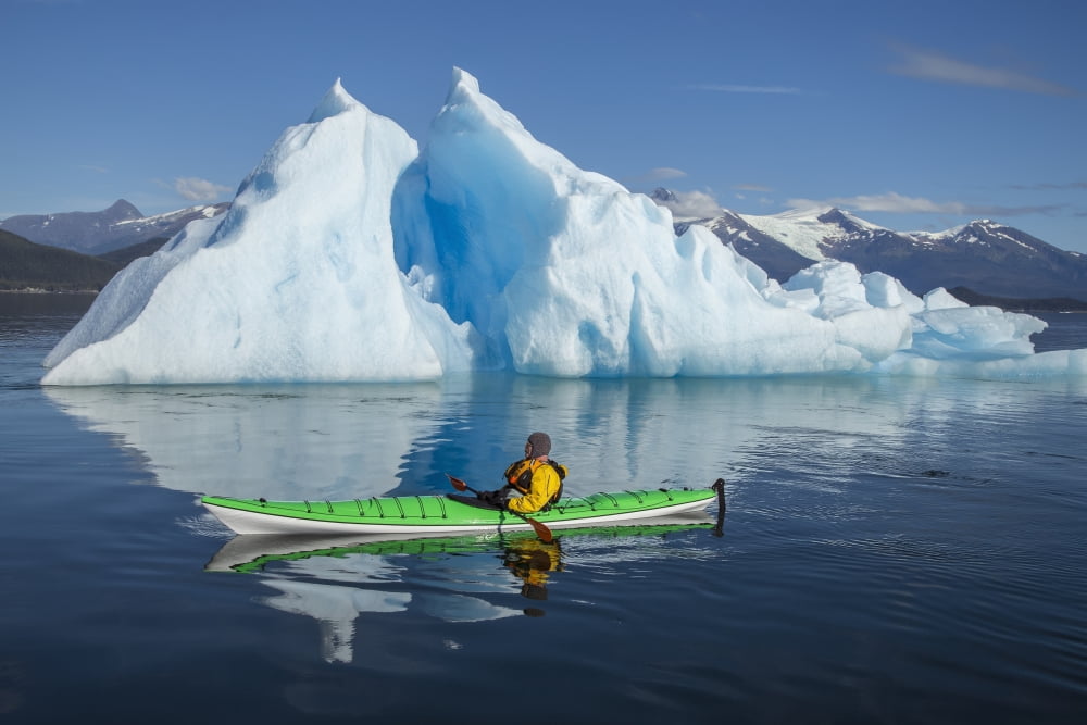 A Sea Kayaker Paddles Beside An Iceberg In Southeast Alaskas Stephens Passage On A Summer Evening Holkham Bay Tracy Arm Mr Ed Emswiler Id#12172012A Canvas Art - John Hyde Design Pics (38 x 24)