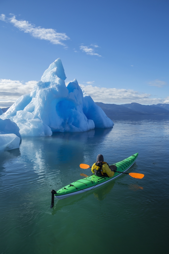 A Sea Kayaker Paddles Beside An Iceberg In Southeast Alaskas Stephens Passage On A Summer Evening Holkham Bay Tracy Arm Mr Ed Emswiler Id#12172012A Canvas Art - John Hyde Design Pics (24 x 38)