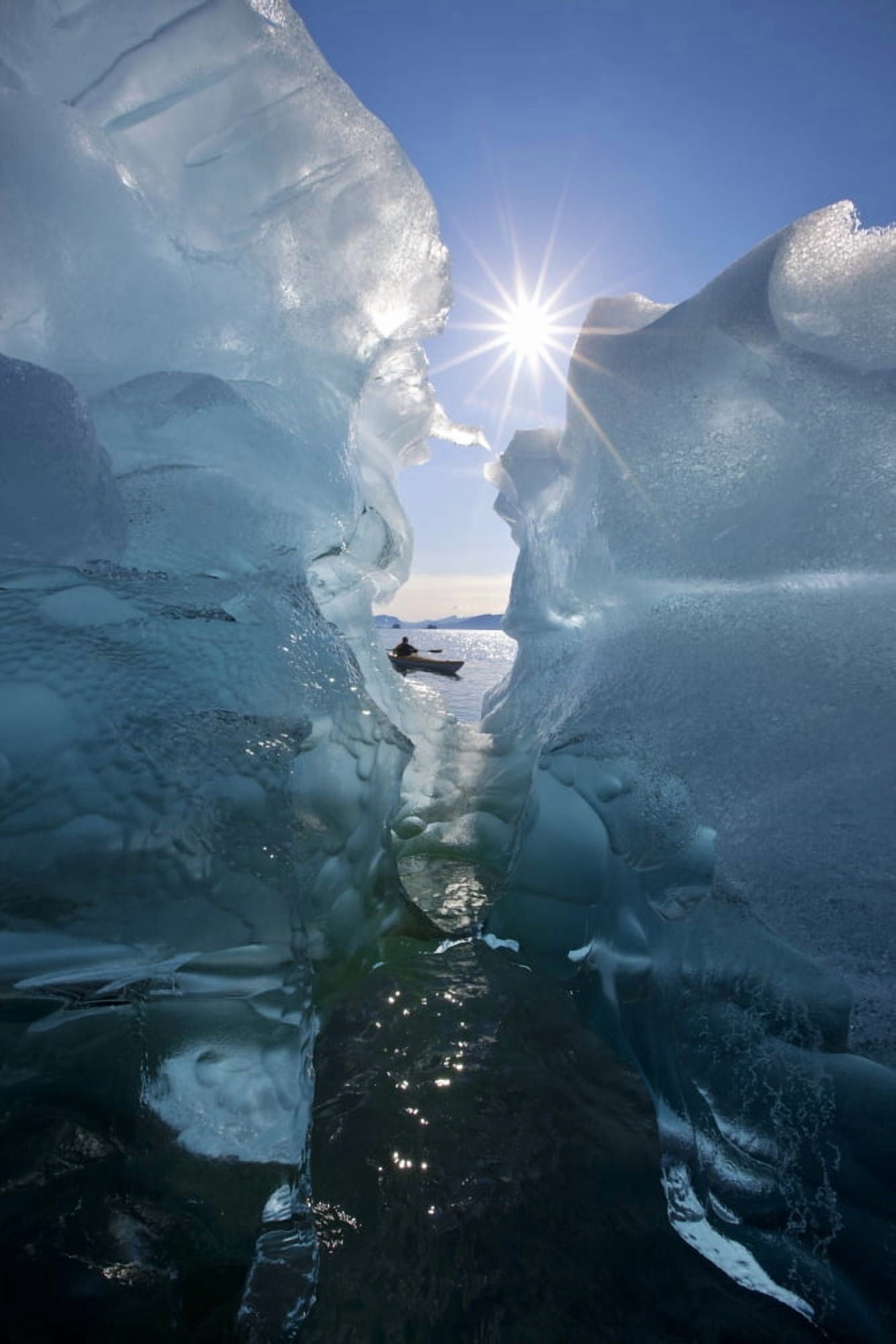 Sea Kayaker Views Large Icebergs In Stephens Passage On A Warm Summer Afternoon Tracy Arm-Fords Terror Wilderness Inside Passage Southeast Alaska Canvas Art - John Hyde Design Pics (12 x 19)