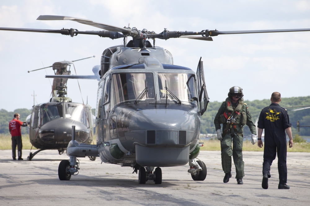 Sea Lynx helicopter and pilot of the German Navy Kiel Germany Canvas Art - Timm ZiegenthalerStocktrek Images (35 x 23)