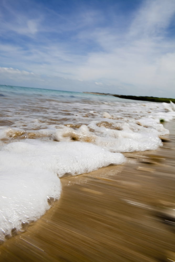 Sea Washing In Onto Sandy Beach Canvas Art - Toby Adamson Design Pics (22 x 34)