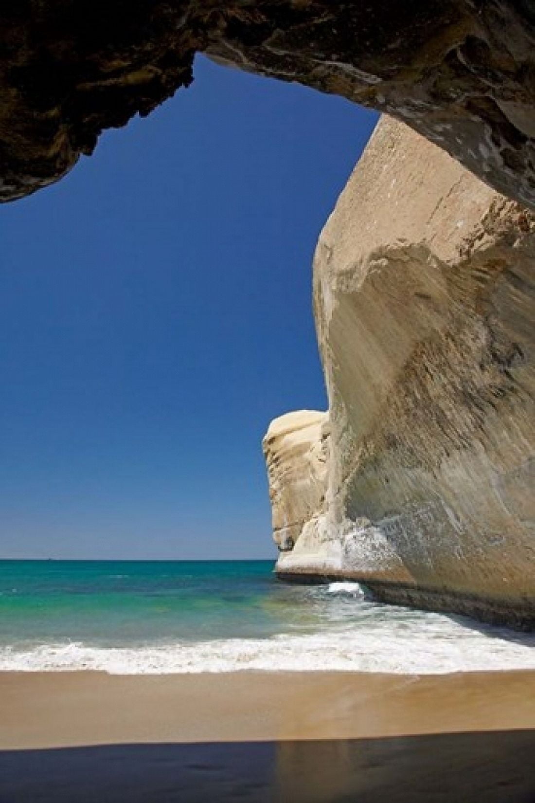 Sea cave beach and cliffs Tunnel Beach Dunedin South Island New Zealand Canvas Art - David Wall  DanitaDelimont (24 x 36)