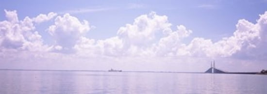 Sea with a container ship and a suspension bridge in distant Sunshine Skyway Bridge Tampa Bay Gulf of Mexico Florida USA Canvas Art - Panoramic Images (36 x 13)