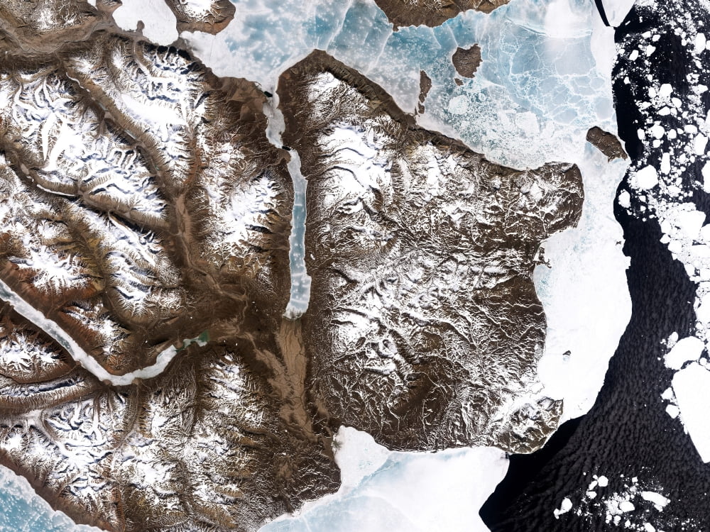 Sea ice lines the shoreline in eastern Greenland Canvas Art - Stocktrek Images (33 x 25)