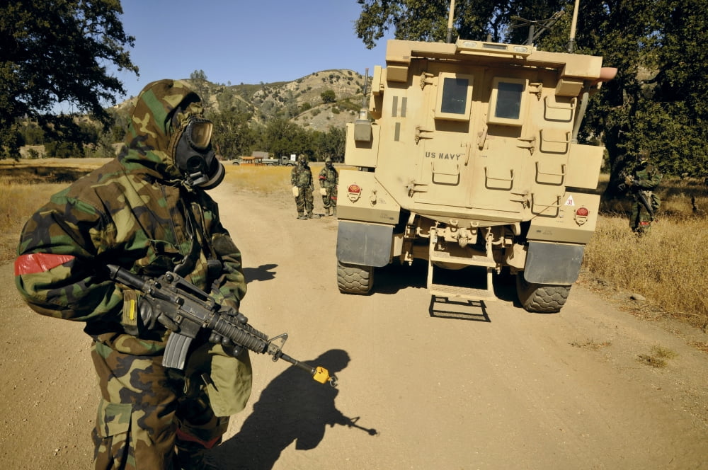 Seabees conduct a wash down of a suspicious vehicle Canvas Art - Stocktrek Images (35 x 23)