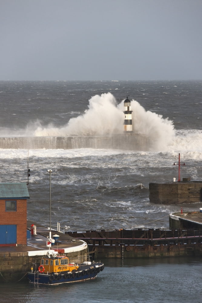 Seaham Teesside England Waves Crashing Into A Lighthouse And A Boat Along The Pier Canvas Art - John Short Design Pics (12 x 19)