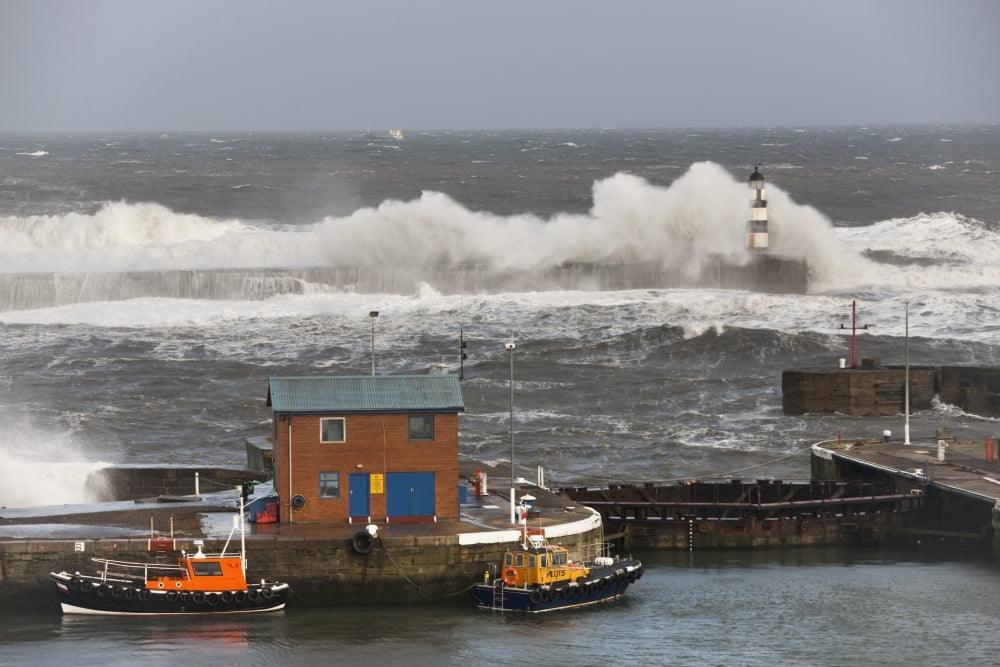 Seaham Teesside England Waves Crashing Into A Lighthouse And Boats Along A Pier Canvas Art - John Short Design Pics (38 x 24)