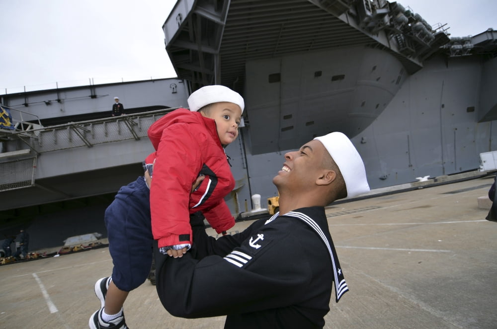 Seaman greets his son during a homecoming celebration Canvas Art - Stocktrek Images (35 x 23)