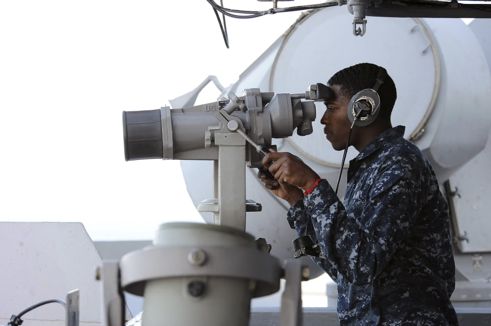 Seaman scans the horizon aboard USS Dwight D Eisenhower Canvas Art - Stocktrek Images (35 x 23)