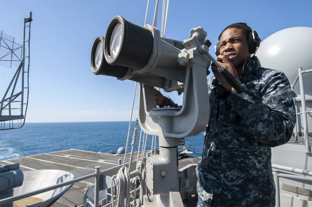 Seaman stands lookout aboard the aircraft carrier USS Harry S Truman Canvas Art - Stocktrek Images (35 x 23)