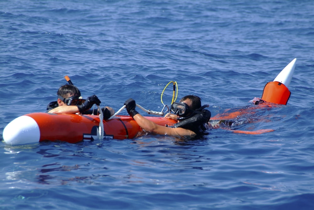 Search and rescue swimmers retrieve a BQM-74E aerial drone Canvas Art - Stocktrek Images (35 x 23)