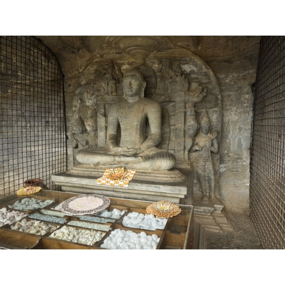Seated Buddha figure called the Vidyhadhara Guha carved from single rock face at