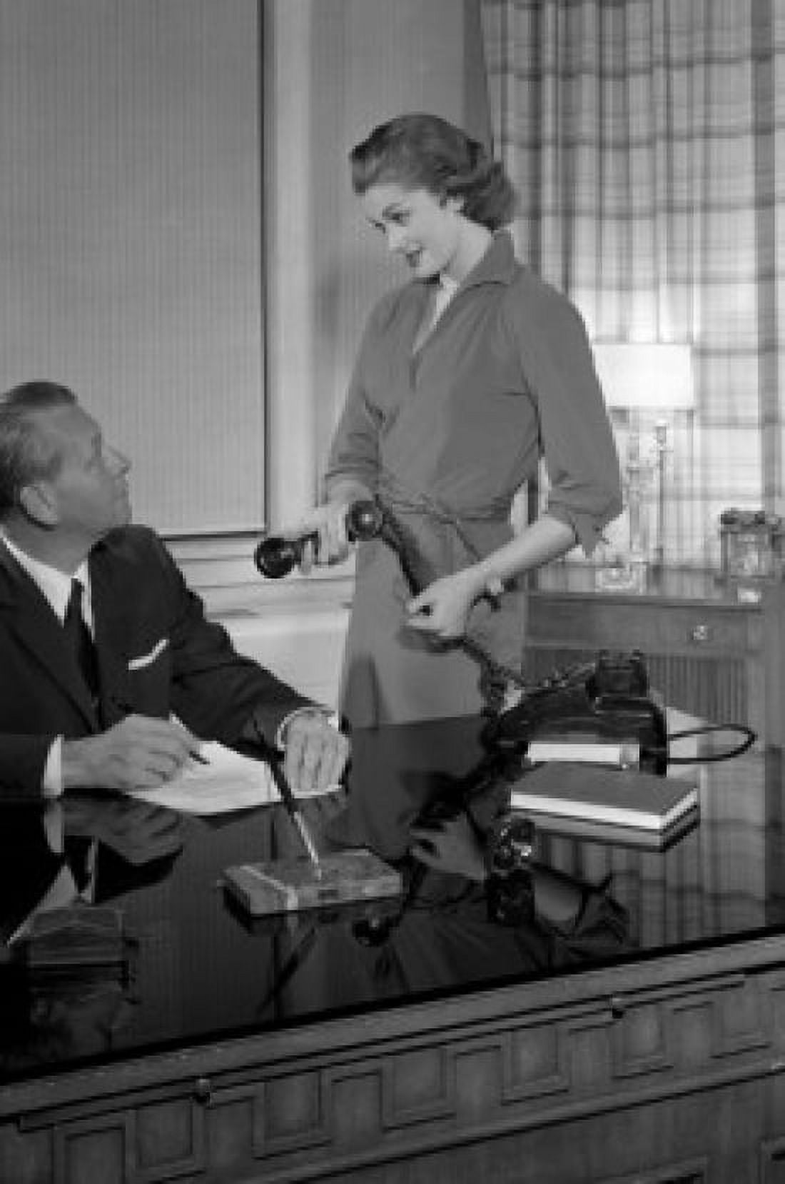 Secretary giving receiver to businessman Canvas Art - (24 x 36)