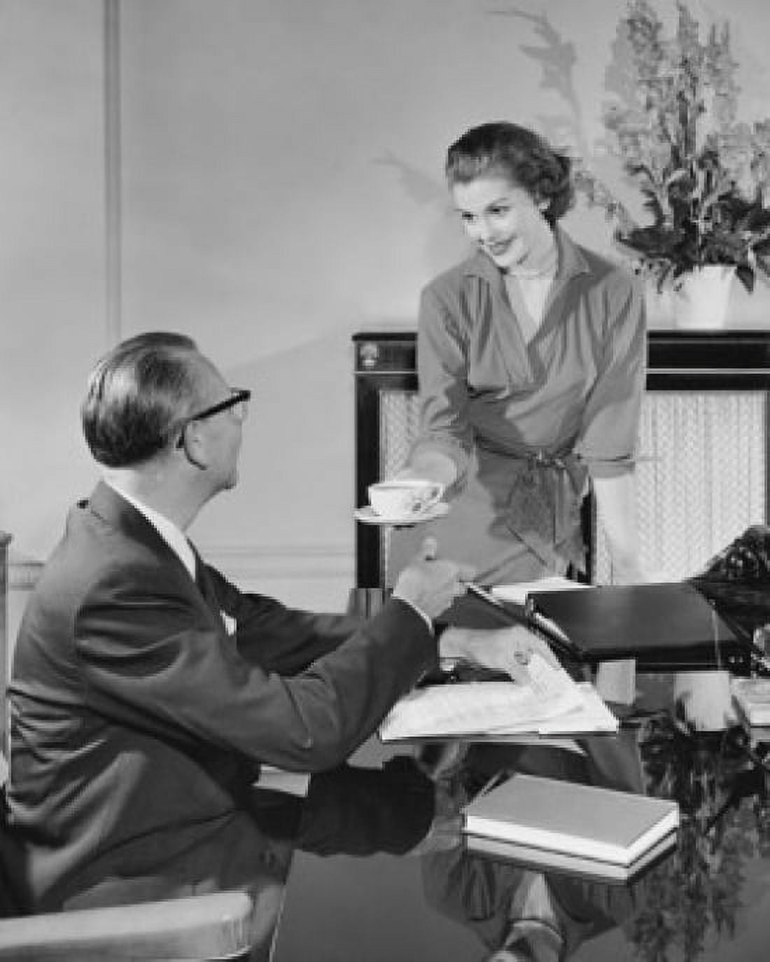 Secretary offering coffee to a businessman in an office Canvas Art - (24 x 36)