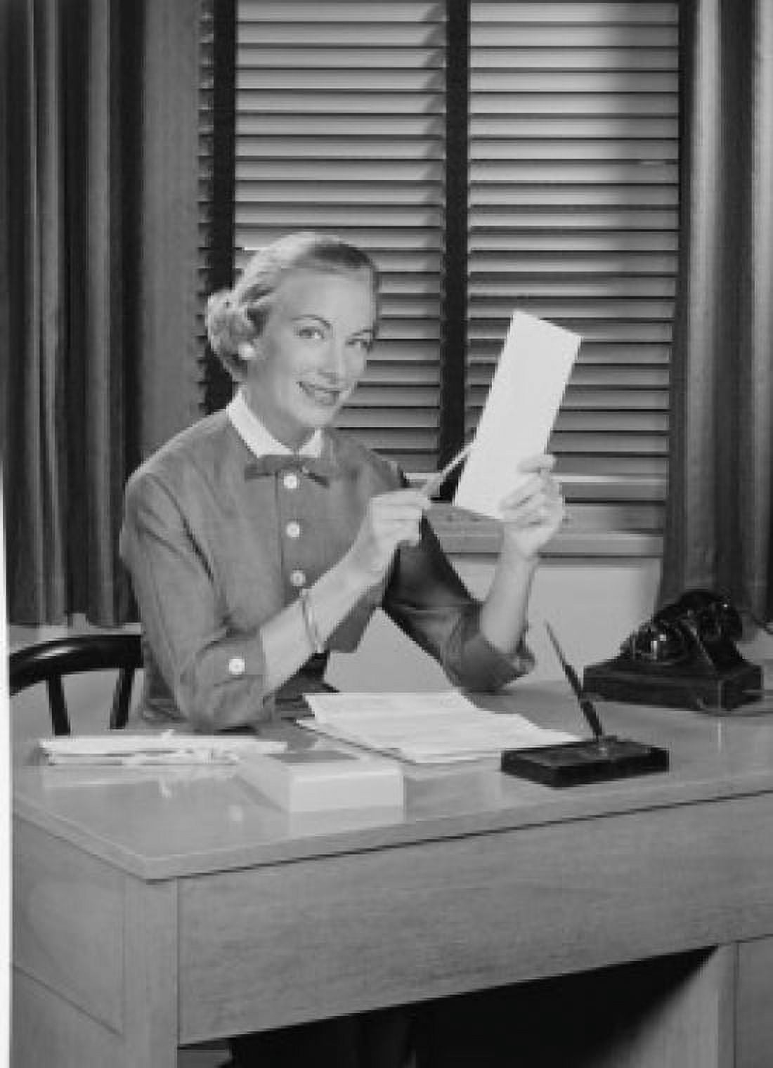 Secretary sitting at desk and opening letter Canvas Art - (24 x 36)