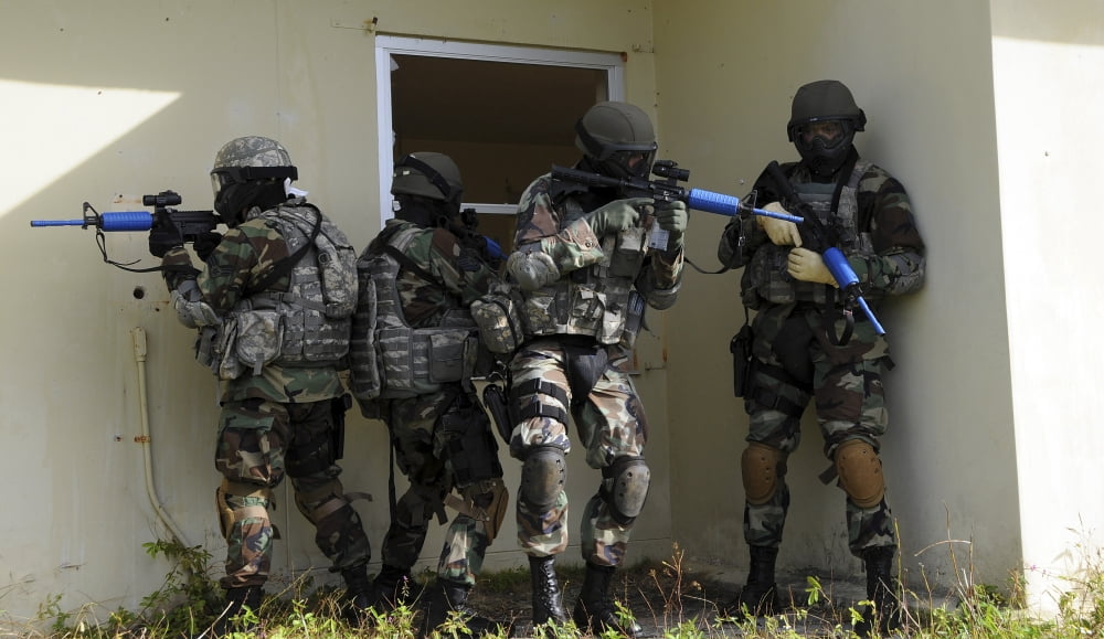 Security Forces members perform a quick check before entering a house Canvas Art - Stocktrek Images (37 x 22)