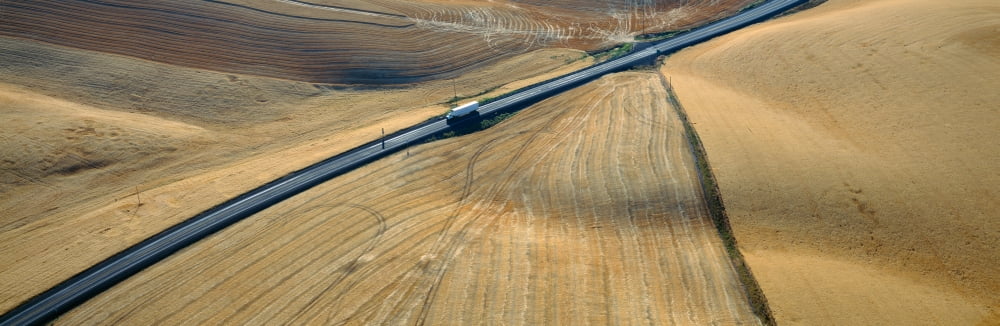 Semi-Truck driving through Wheat Fields SE Washington Canvas Art - Panoramic Images (27 x 9)