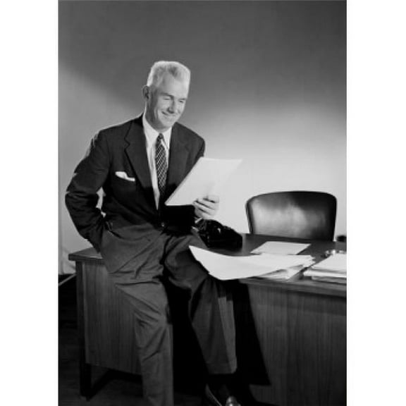 Senior Businessman Reading in Office Poster Print - 18 x 24 in.