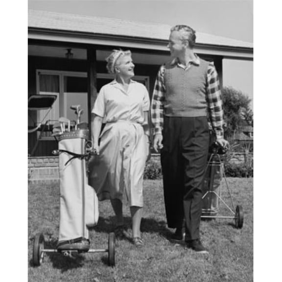 Senior Couple Walking with Golf Clubs on Golf Course Poster Print - 18 x 24 in.