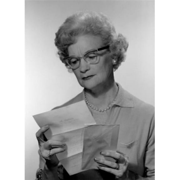 Senior Woman Reading Letter Studio Shot Poster Print - 18 x 24 in.
