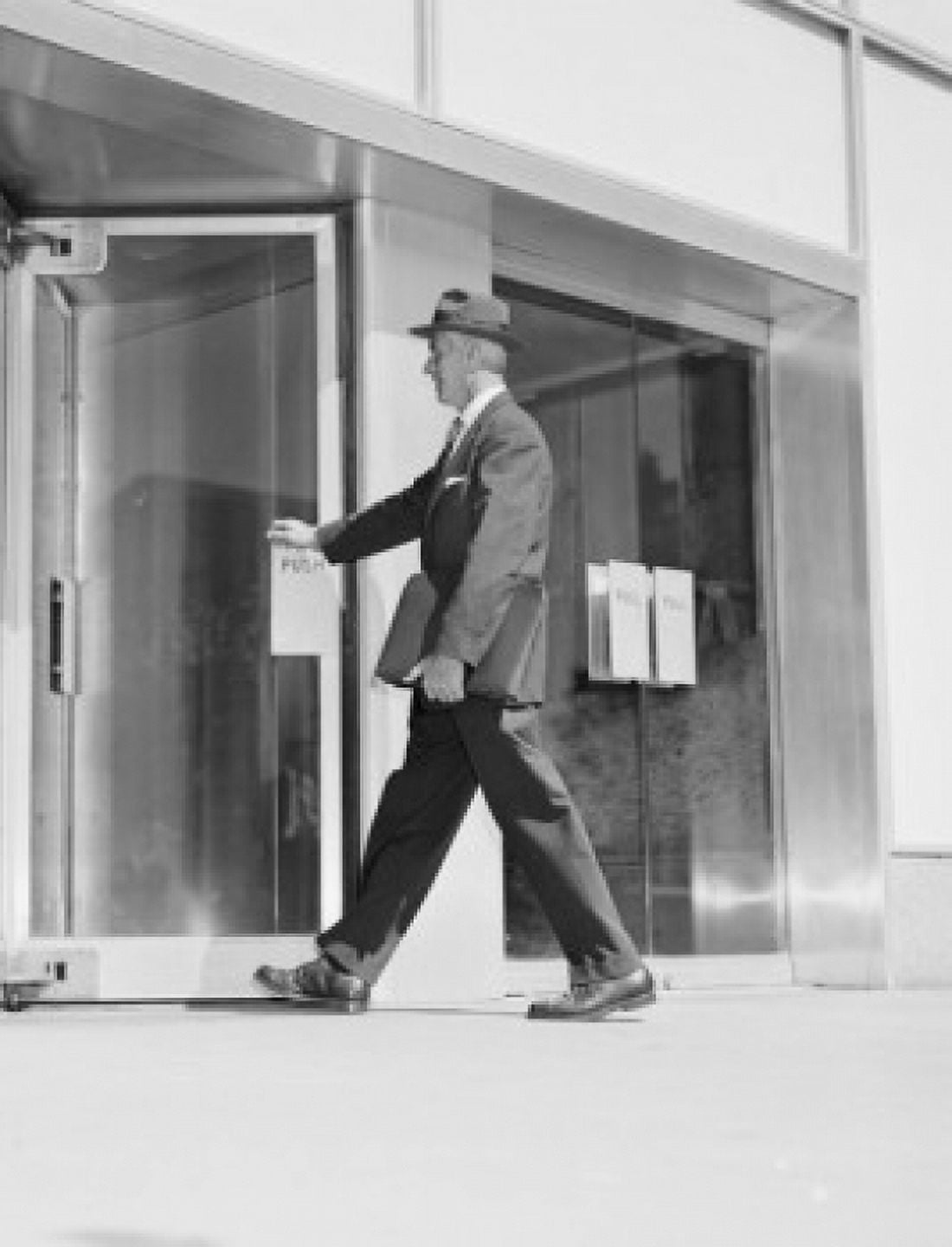 Senior businessman entering office building Canvas Art - (18 x 24)