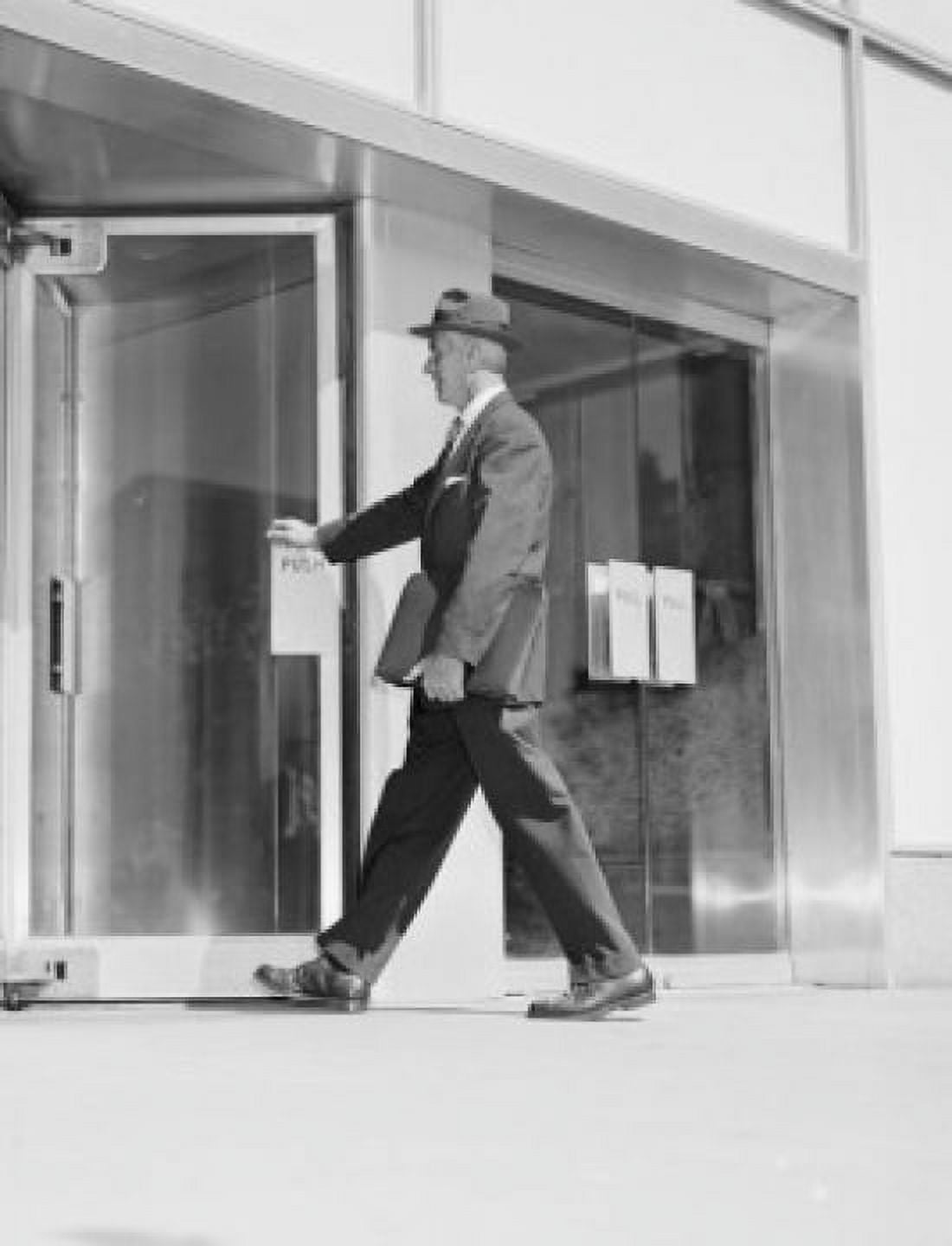 Senior businessman entering office building Canvas Art - (24 x 36)