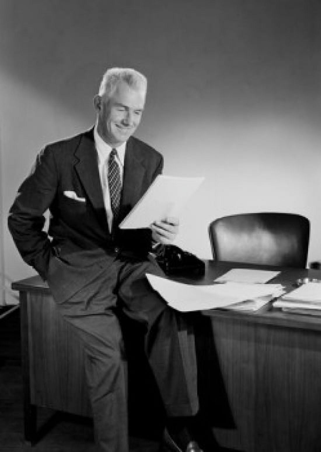 Senior businessman reading in office Canvas Art - (24 x 36)
