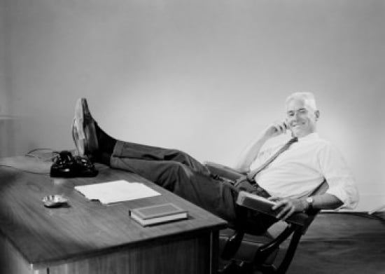 Senior businessman sitting behind desk with feet up Canvas Art - (18 x 24)