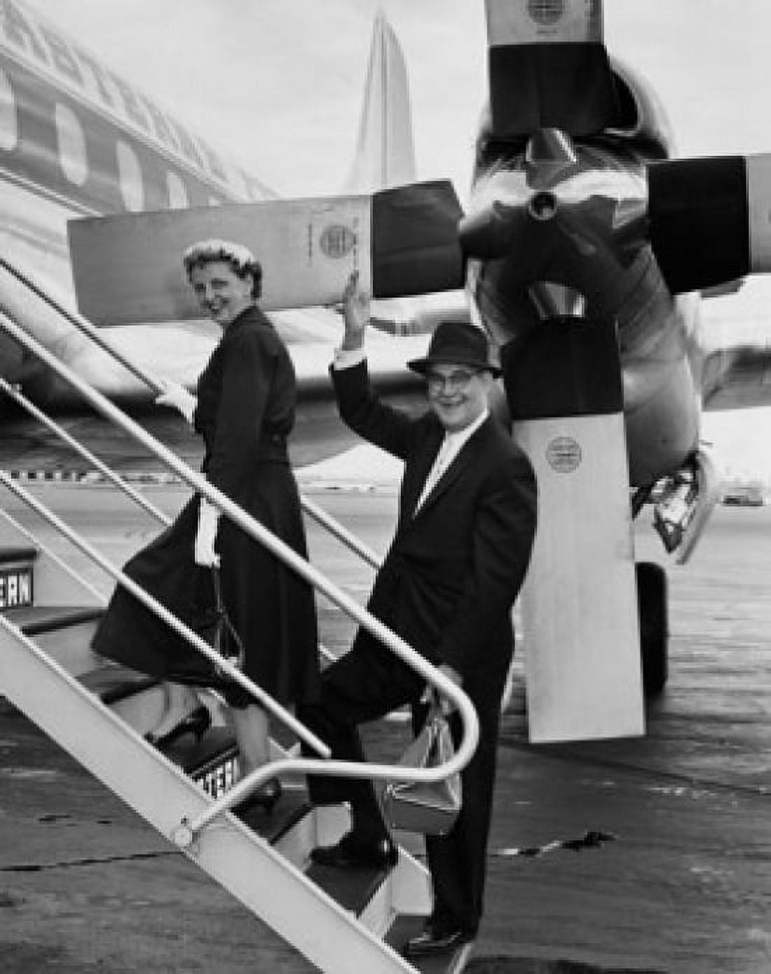 Senior couple boarding an airplane Canvas Art - (18 x 24)