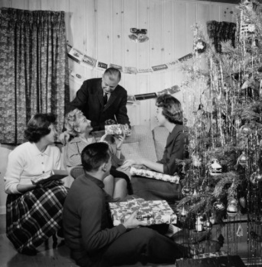 Senior couple celebrating Christmas with children Canvas Art - (18 x 24)