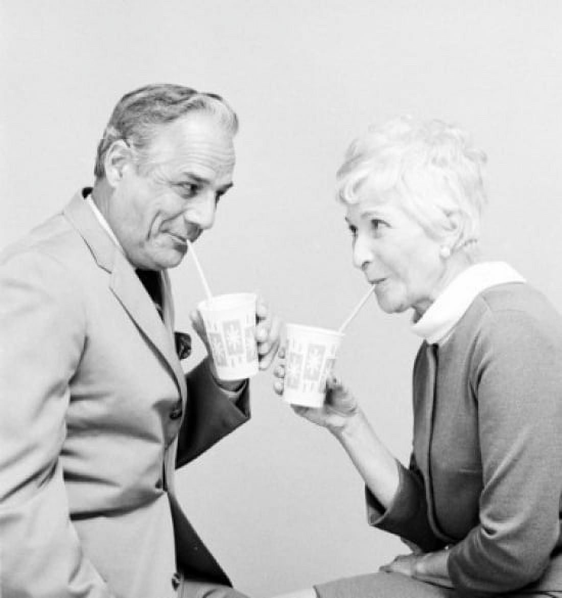 Senior couple drinking and looking each other Canvas Art - (18 x 24)