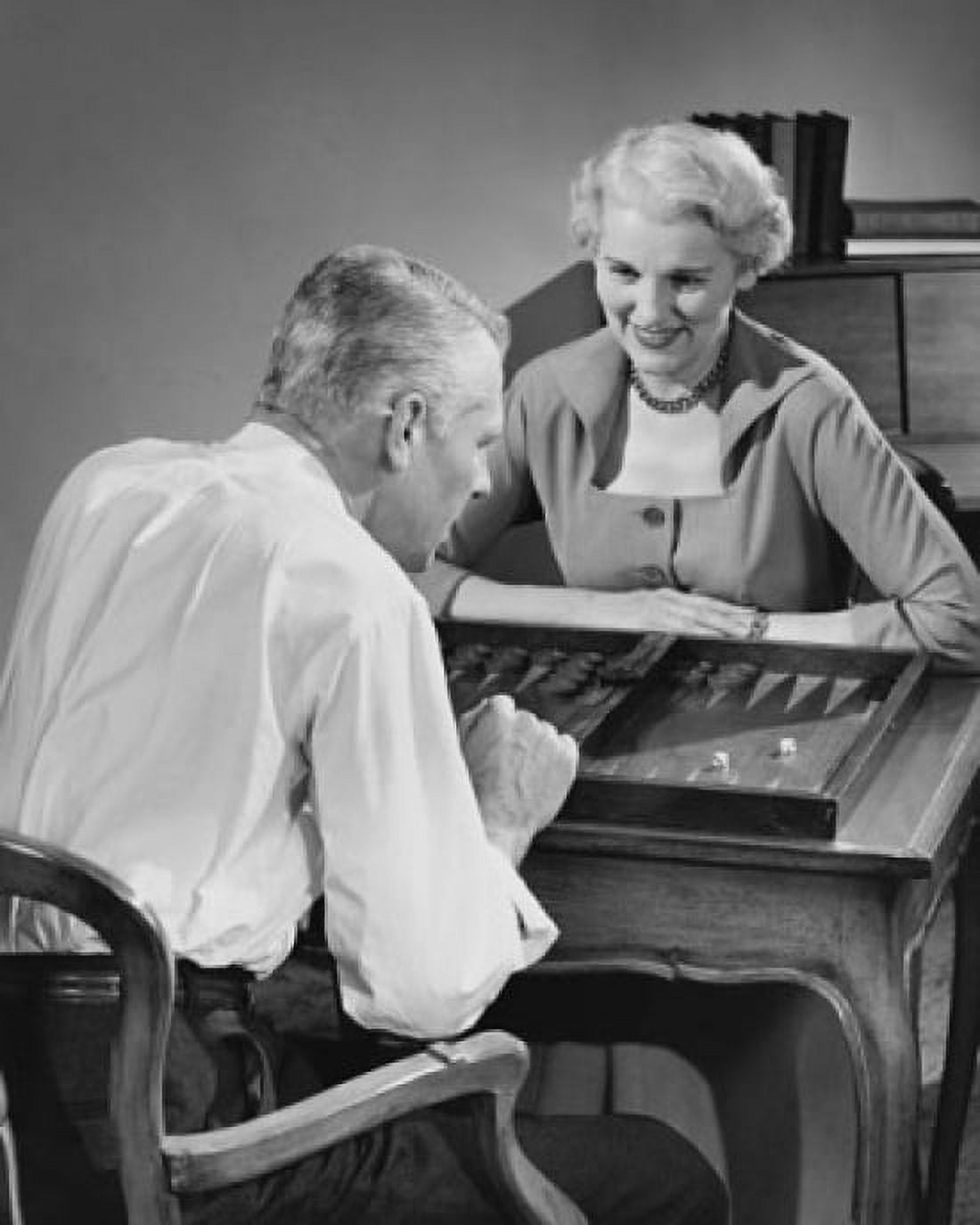 Senior couple playing backgammon Canvas Art - (24 x 36)