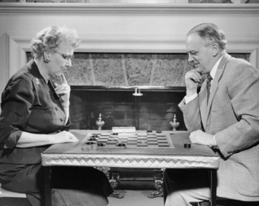 Senior couple playing checkers Canvas Art - (18 x 24)